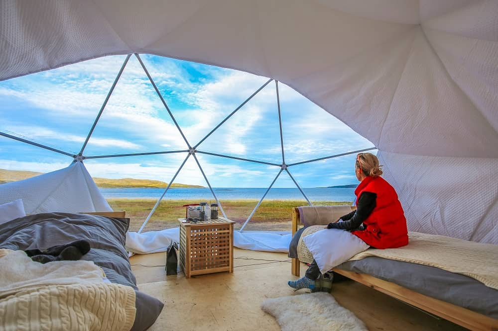 Two beds inside a glamping tent