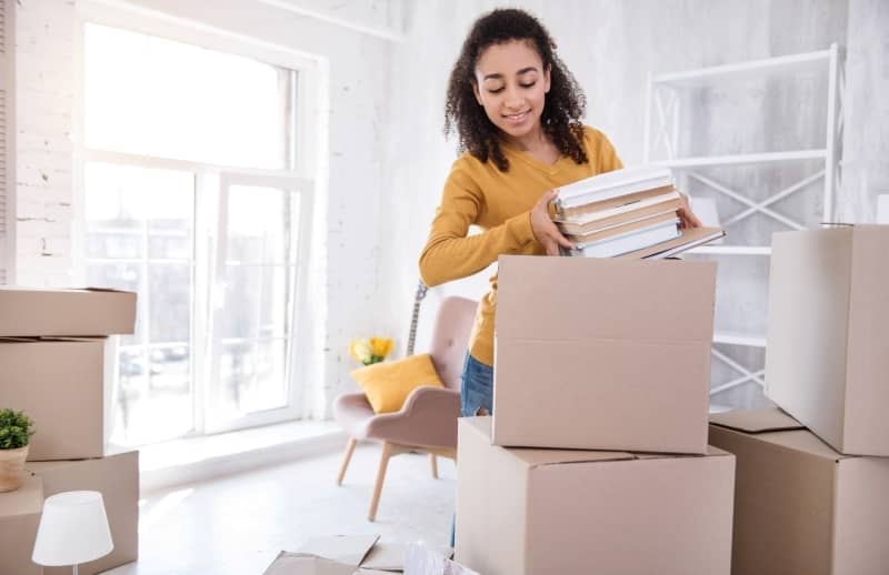 Woman packing her stuff for moving.